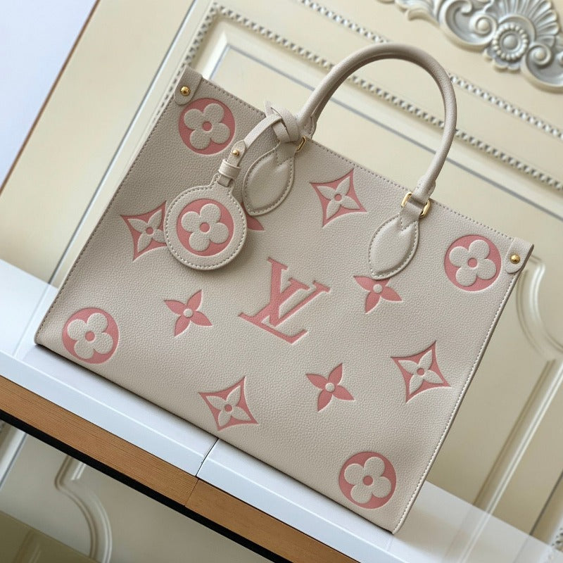 Bolsa con monograma Onthego color leche y rosa