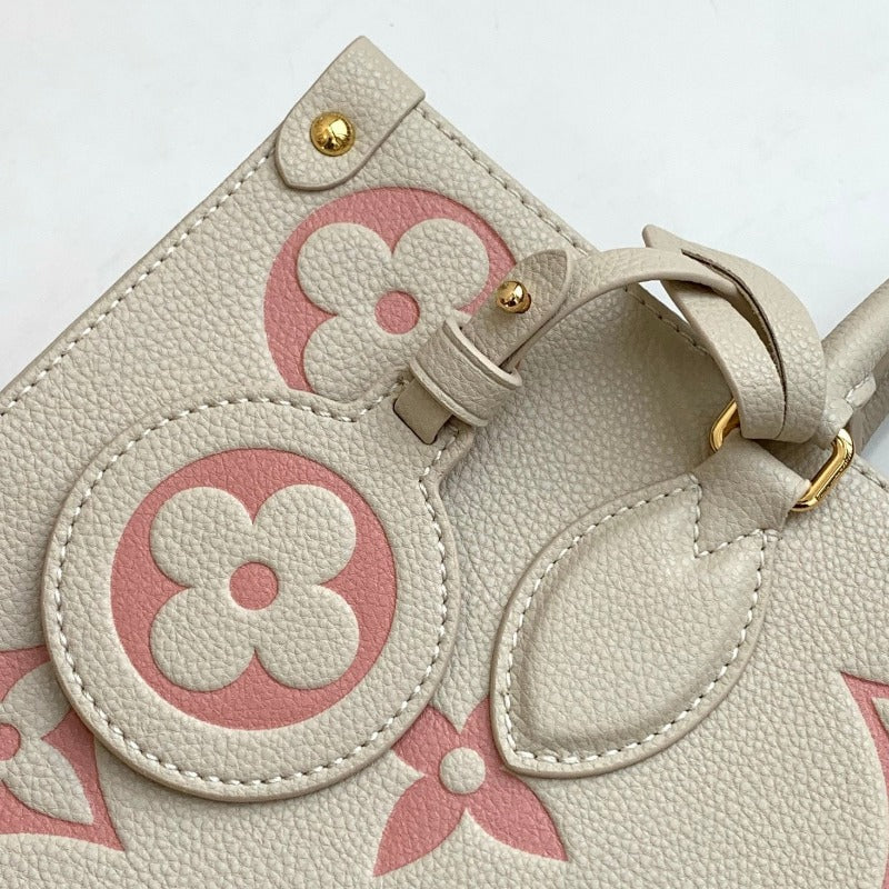 Bolsa con monograma Onthego color leche y rosa