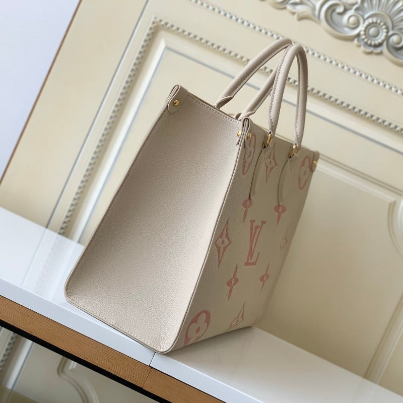 Bolsa con monograma Onthego color leche y rosa
