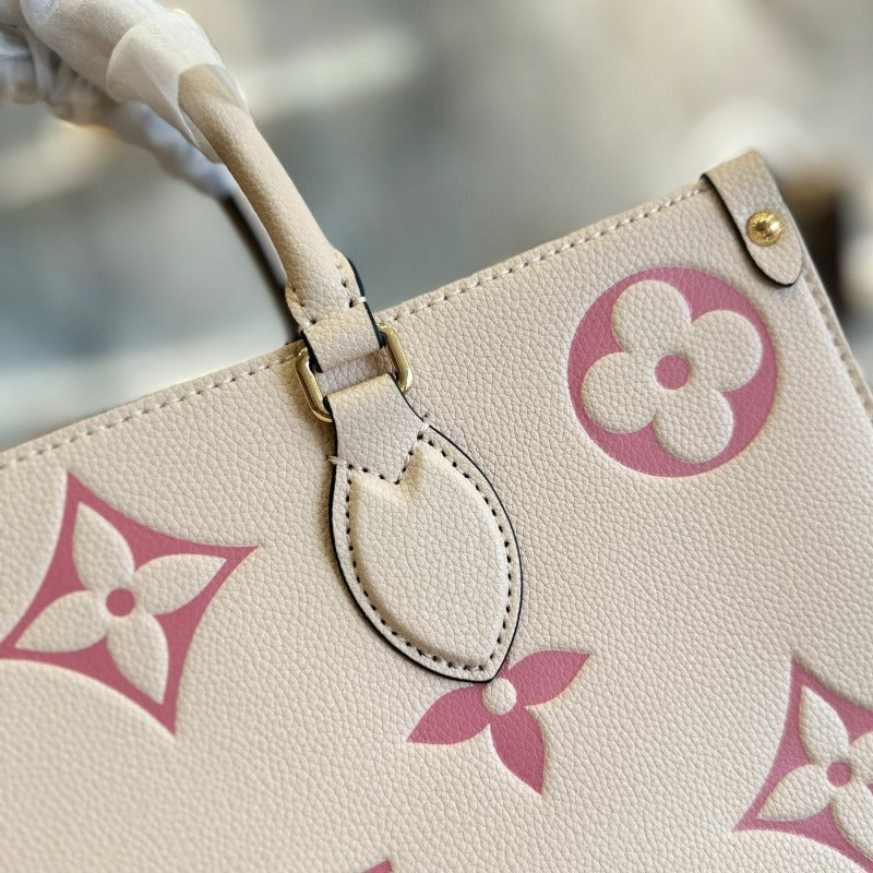 Bolsa con monograma Onthego color leche y rosa