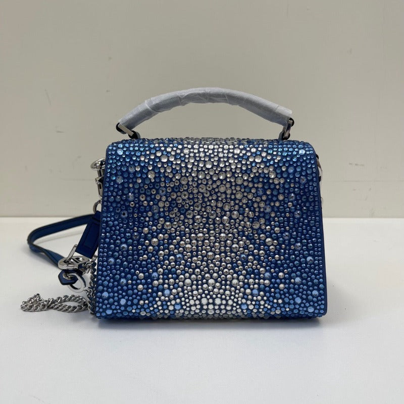 Bolso mini con lentejuelas de cristal y asa superior en azul y plata