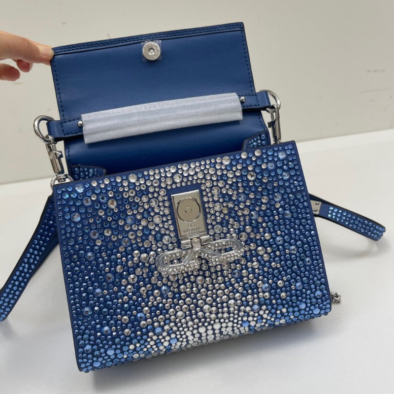 Bolso mini con lentejuelas de cristal y asa superior en azul y plata