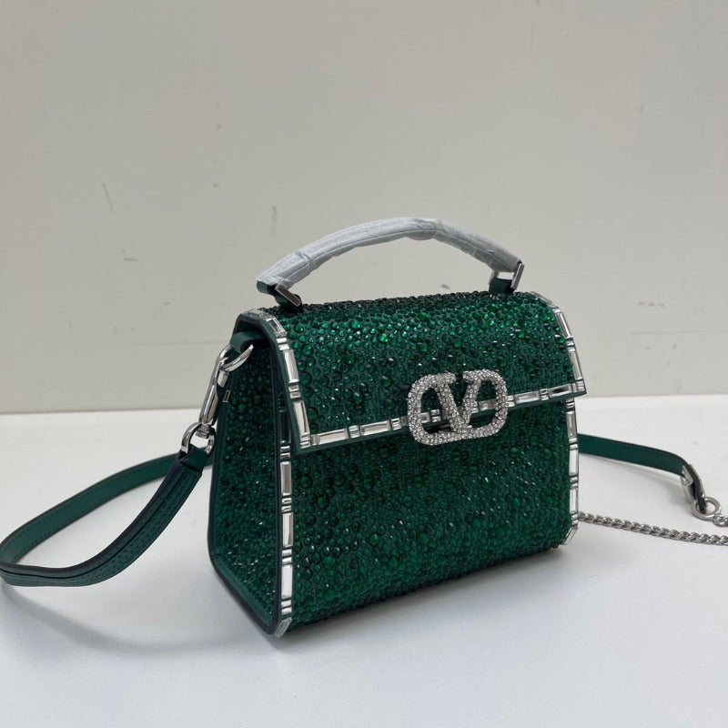 Bolso mini con asa superior y lentejuelas de cristal verde